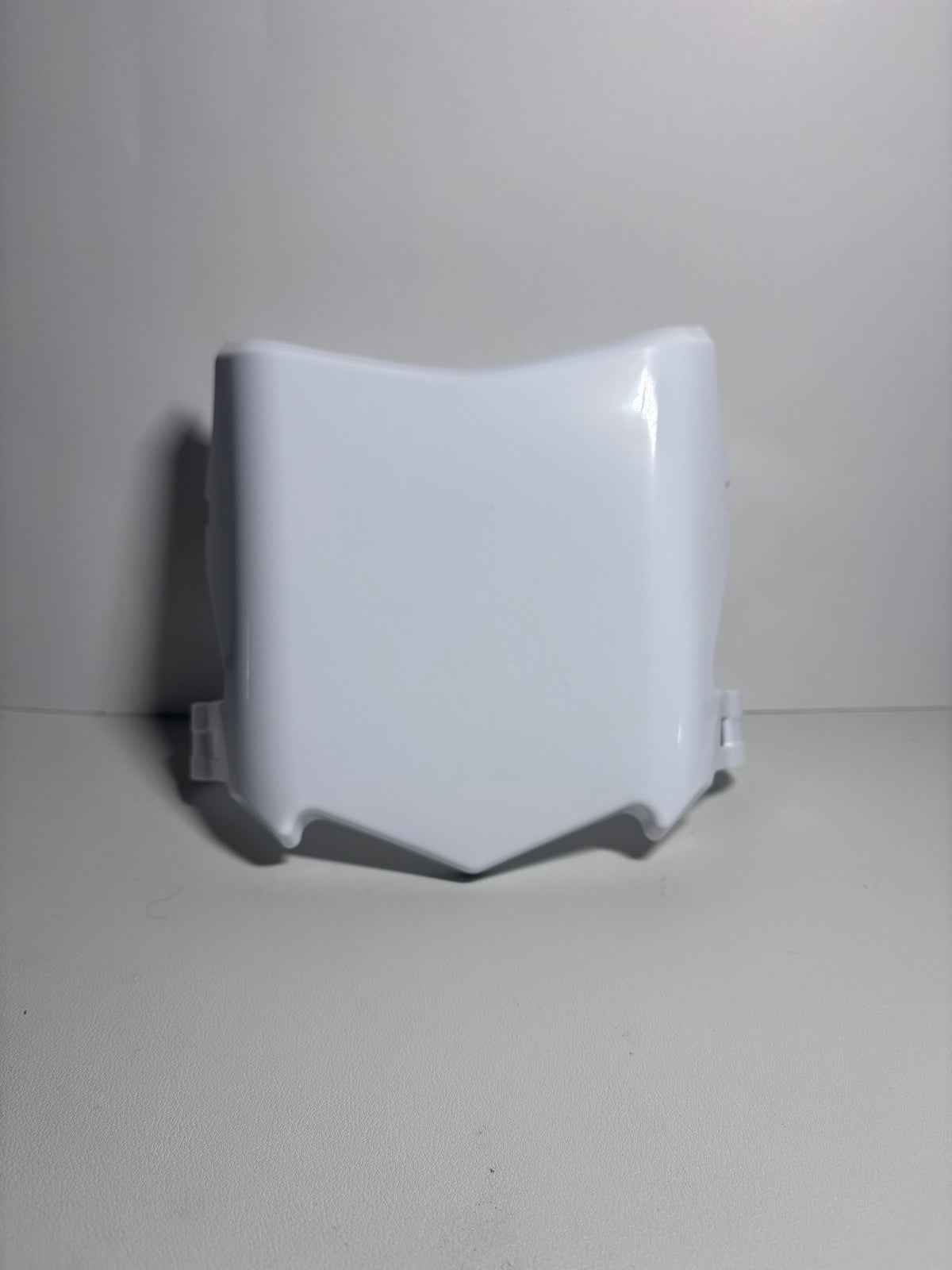 Glossy white moto cuts plate